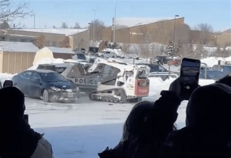 skid steer vs police car|WATCH: Man Does Donuts, Rams A Police Car & A Liquor Store .